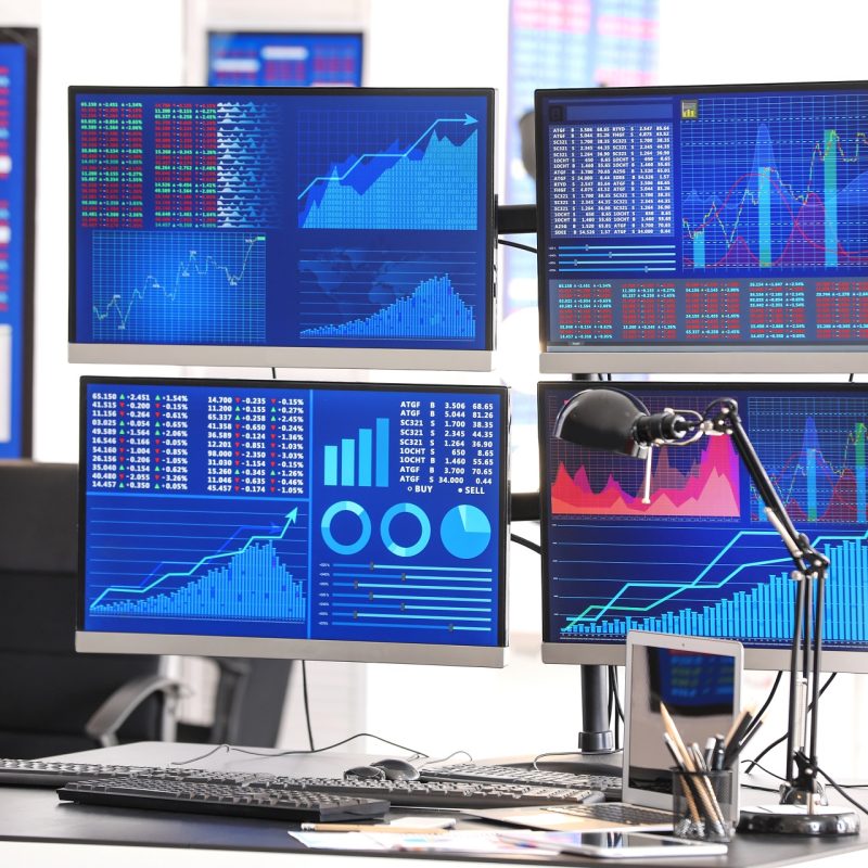 Stock exchange trader's workplace with computers